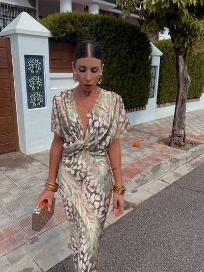 Woman in maxi dress with V-neck and wrap waist