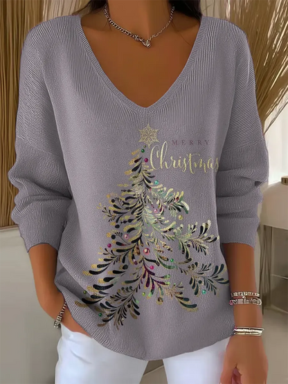 Woman wearing V-neck Christmas sweater with festive print