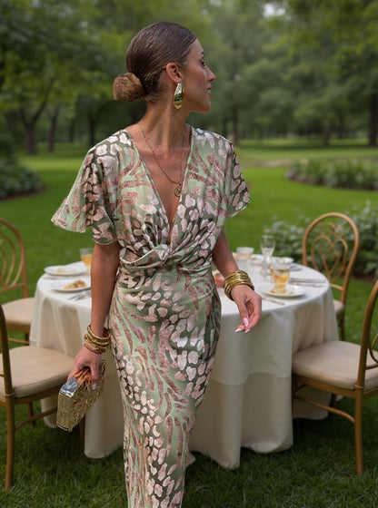 Woman in maxi dress with V-neck and wrap waist