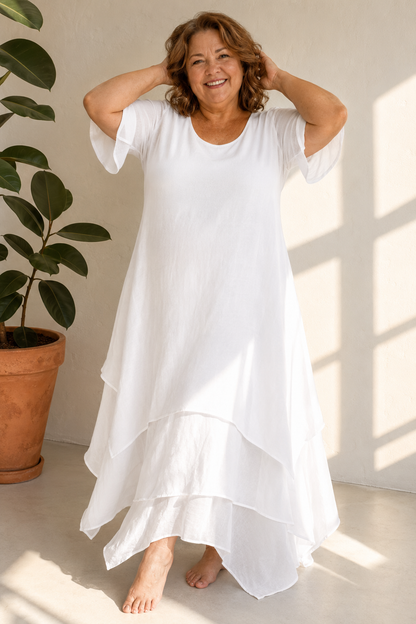 Woman wearing flowing maxi dress with open neckline