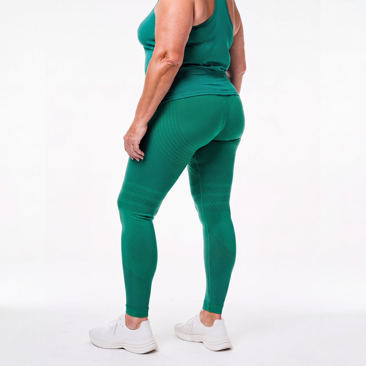 Woman wearing fitted 3D sculpting leggings in studio