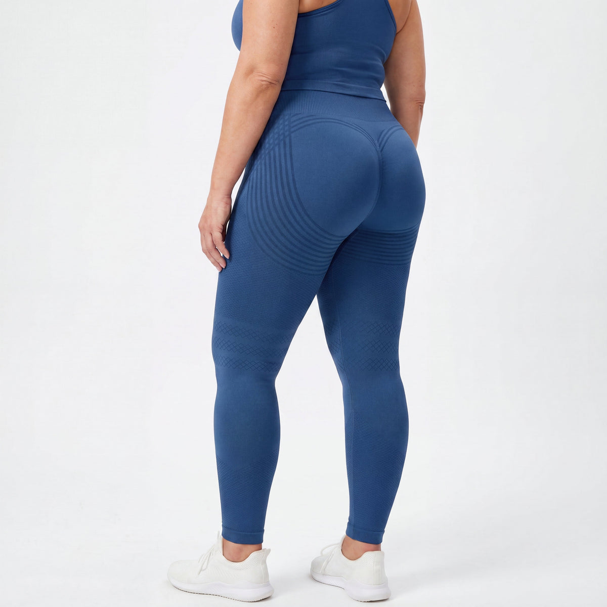 Woman wearing fitted 3D sculpting leggings in studio