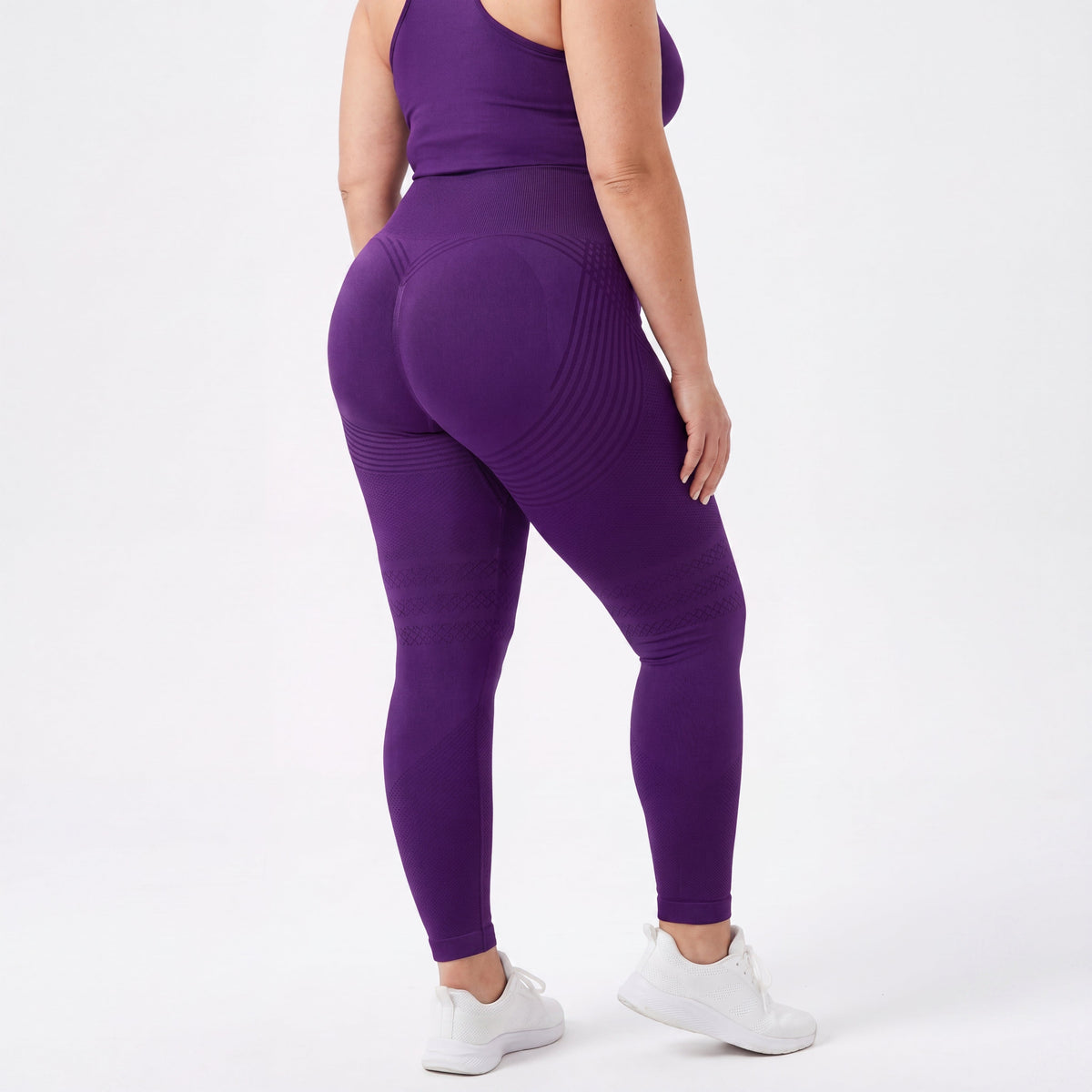 Woman wearing fitted 3D sculpting leggings in studio