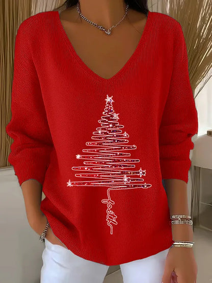 Woman wearing V-neck Christmas sweater with festive print