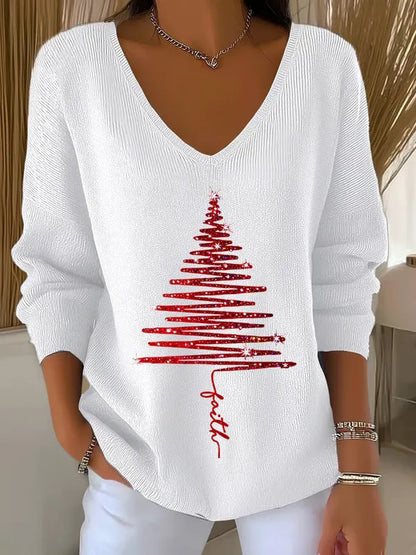 Woman wearing V-neck Christmas sweater with festive print