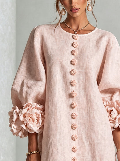 Woman wearing pink floral mini dress with rosette cuffs