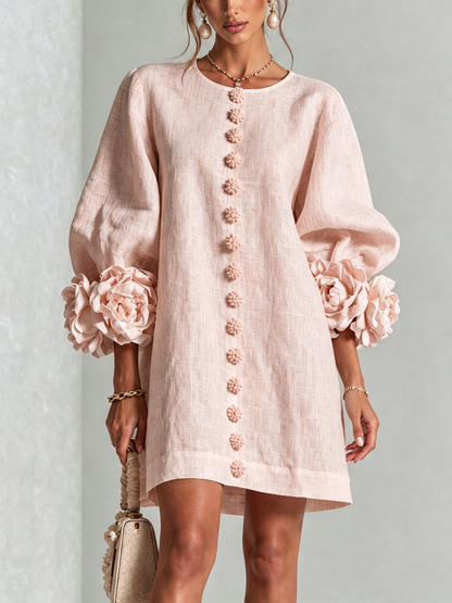 Woman wearing pink floral mini dress with rosette cuffs
