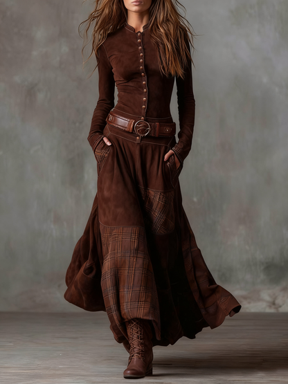 Woman wearing navy patchwork maxi dress with matching belt