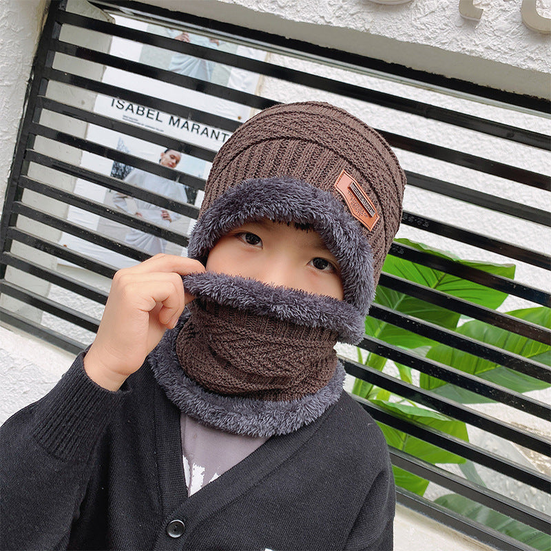 Women's knit beanie and scarf set in winter colors
