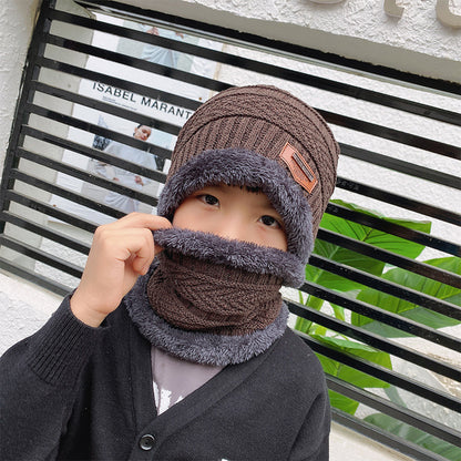 Women's knit beanie and scarf set in winter colors