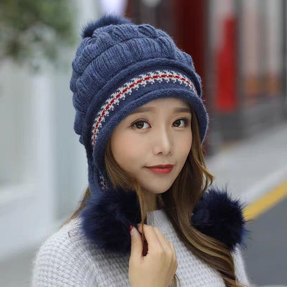 Women's knit beanie with ear flaps and pompom