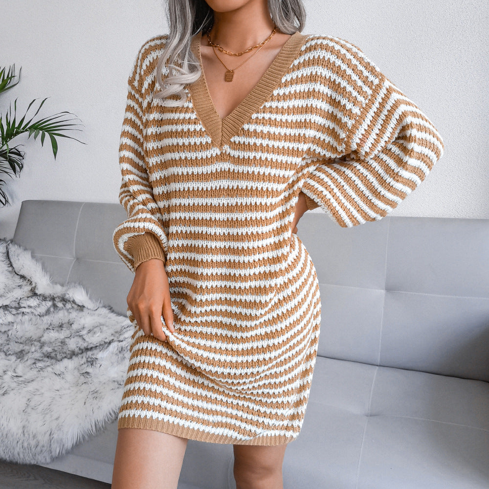 Woman wearing striped V-neck long sleeve sweater dress