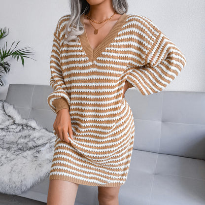 Woman wearing striped V-neck long sleeve sweater dress