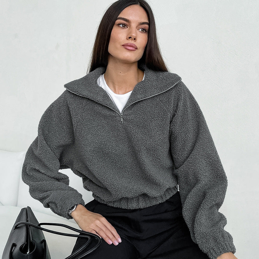 Woman wearing gray lamb fleece jacket with jeans