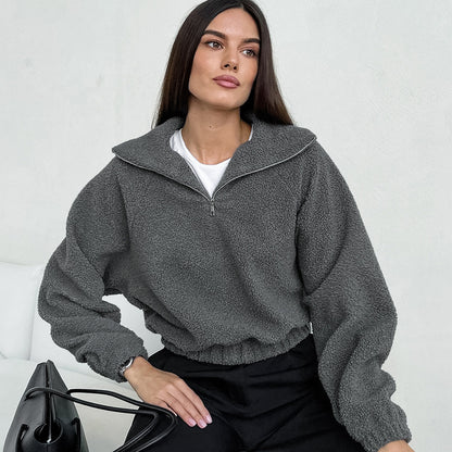 Woman wearing gray lamb fleece jacket with jeans