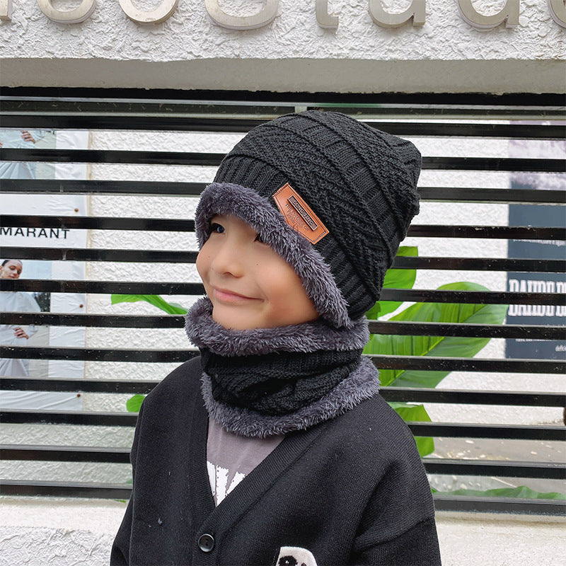 Women's knit beanie and scarf set in winter colors