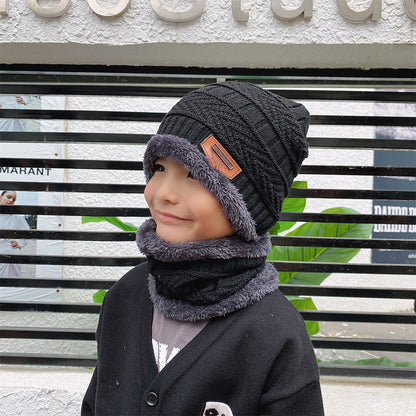 Women's knit beanie and scarf set in winter colors