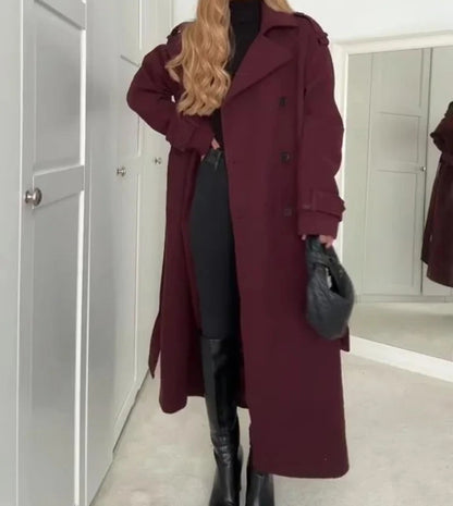 Woman wearing wine red double-breasted long coat with belt