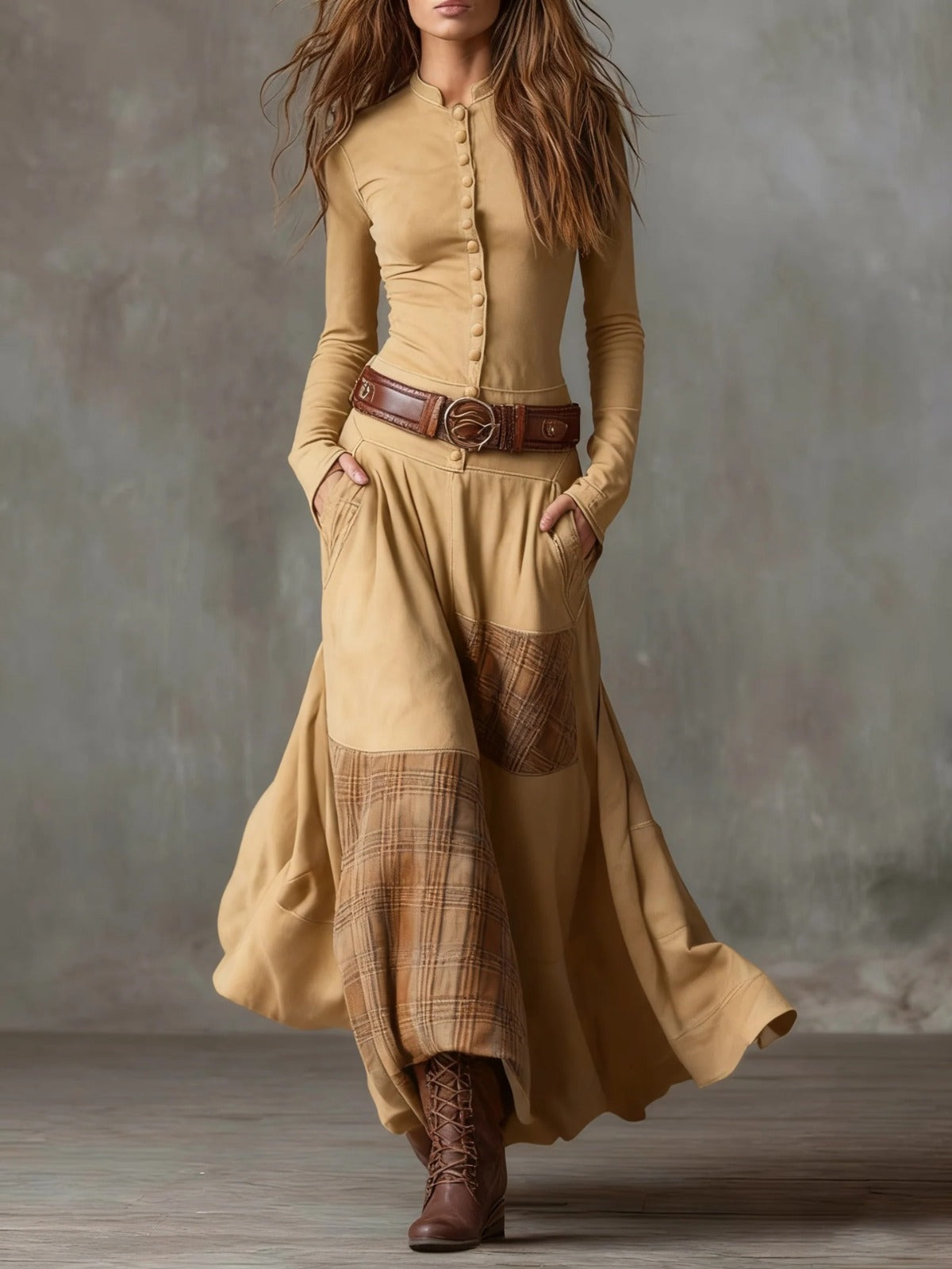 Woman wearing navy patchwork maxi dress with matching belt