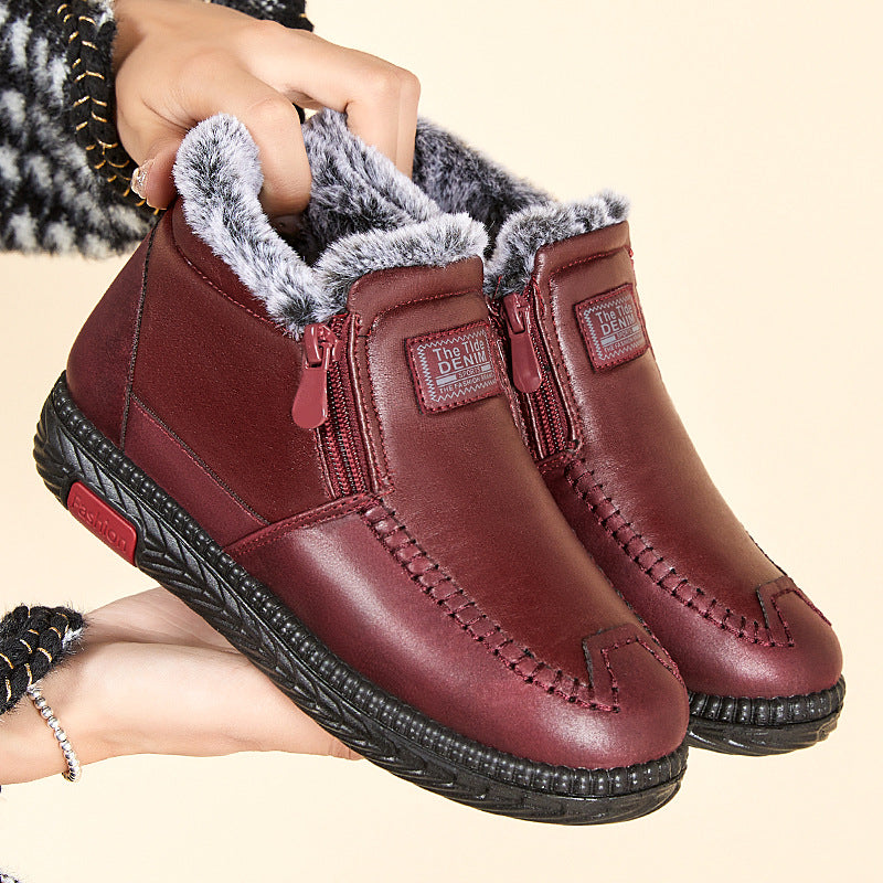 Women's black plush lined winter ankle boots with flat heel