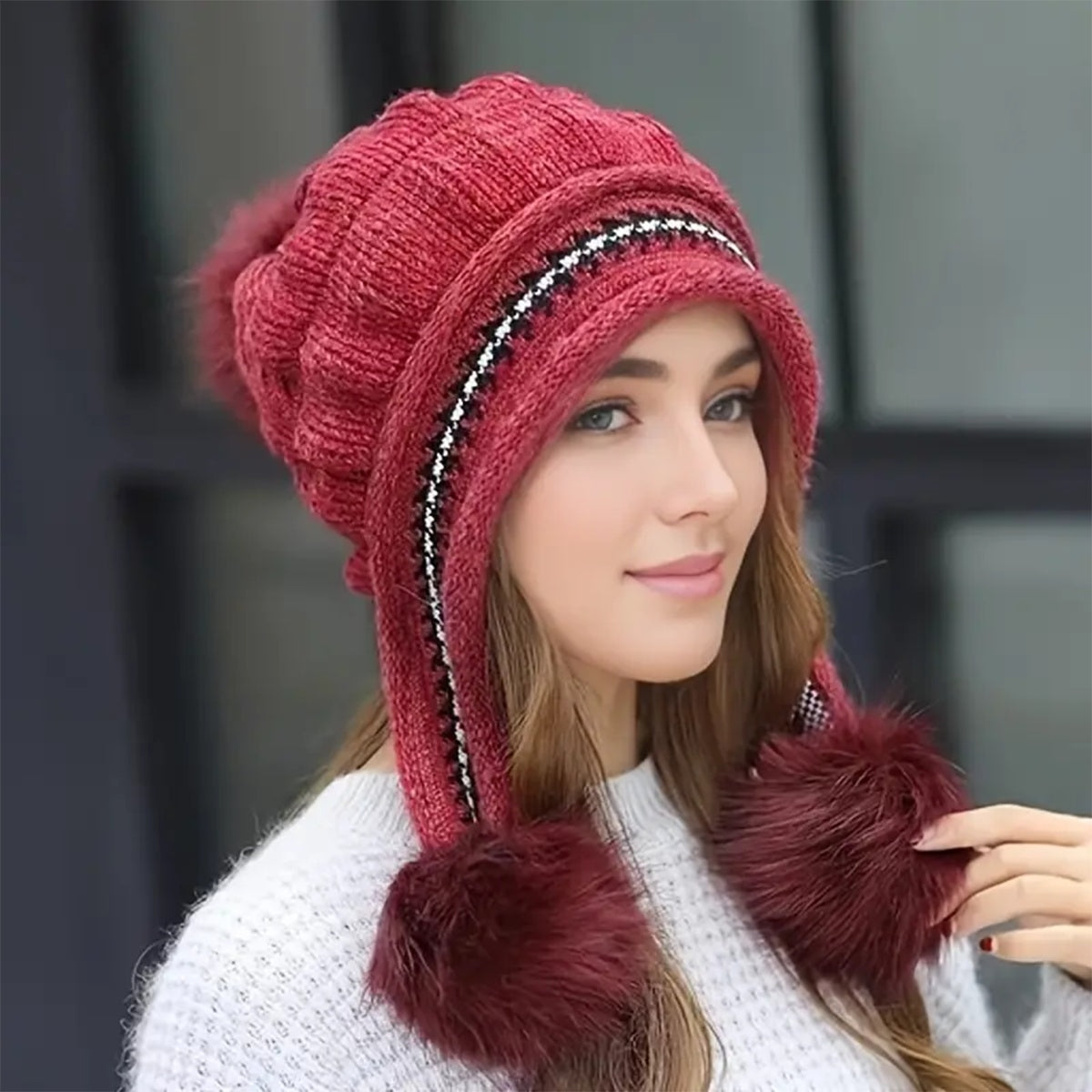Women's knit beanie with ear flaps and pompom