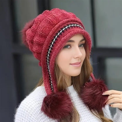 Women's knit beanie with ear flaps and pompom