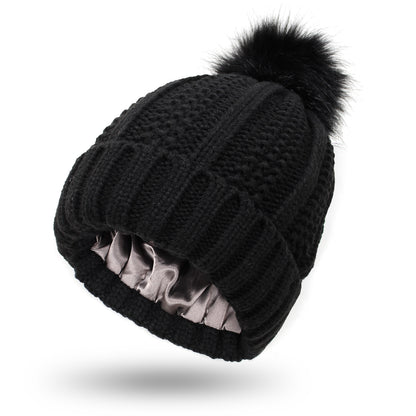 Women's knit beanie with faux fur pom pom