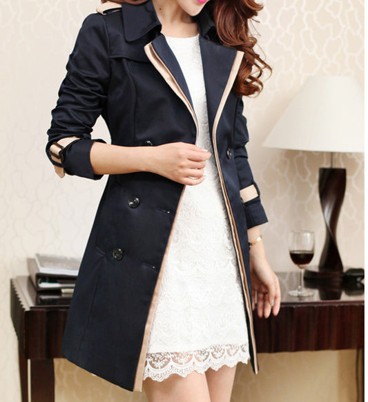 Woman wearing black long trench coat with long sleeves