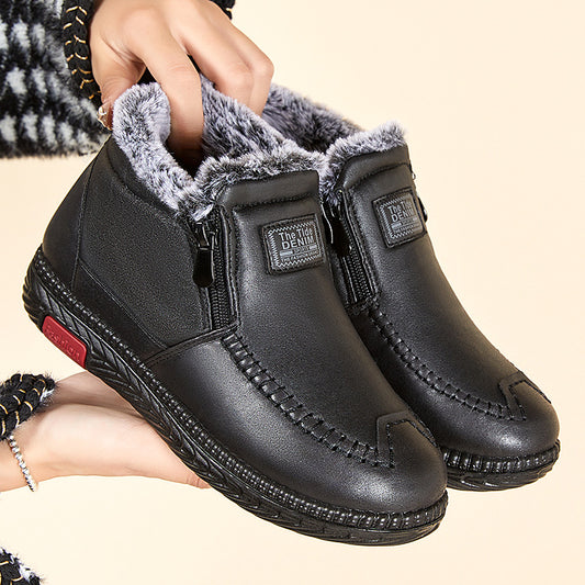 Women's black plush lined winter ankle boots with flat heel