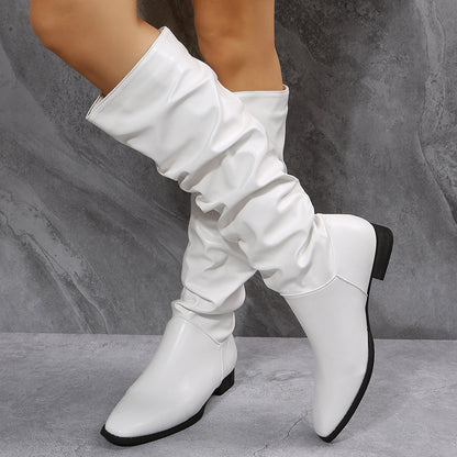 Women's tall boots in black and white with low heel