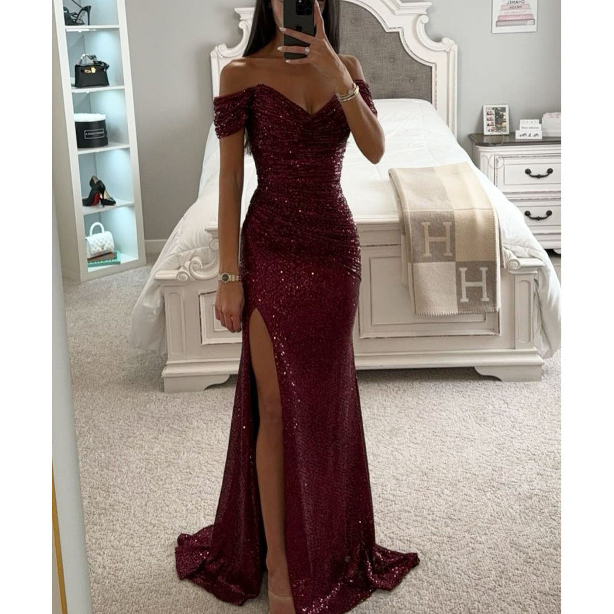 Woman in off-shoulder split party dress, solid color