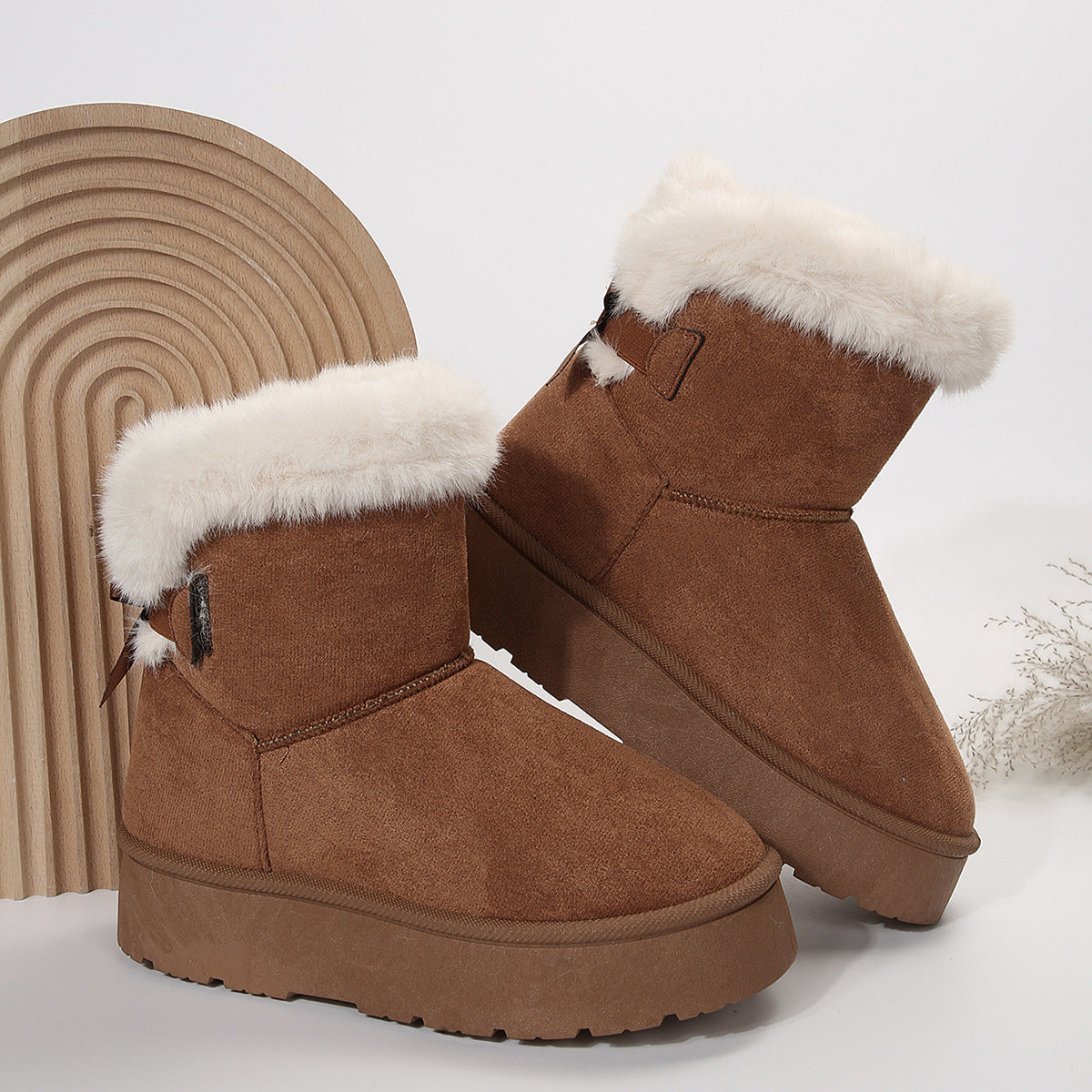 Women's black bow detail mid-top snow boots with plush lining