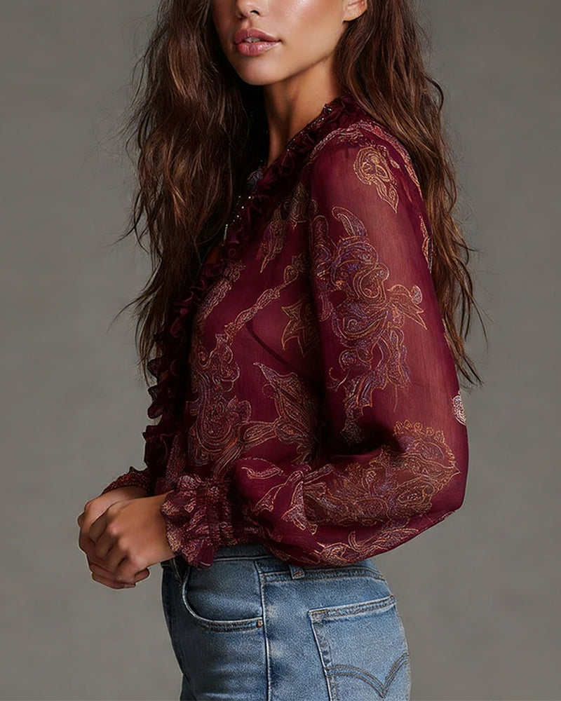 Woman wearing V-neck ruffle sleeve blouse with print