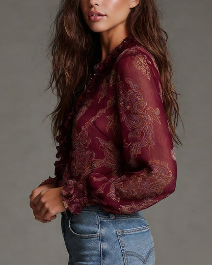 Woman wearing V-neck ruffle sleeve blouse with print