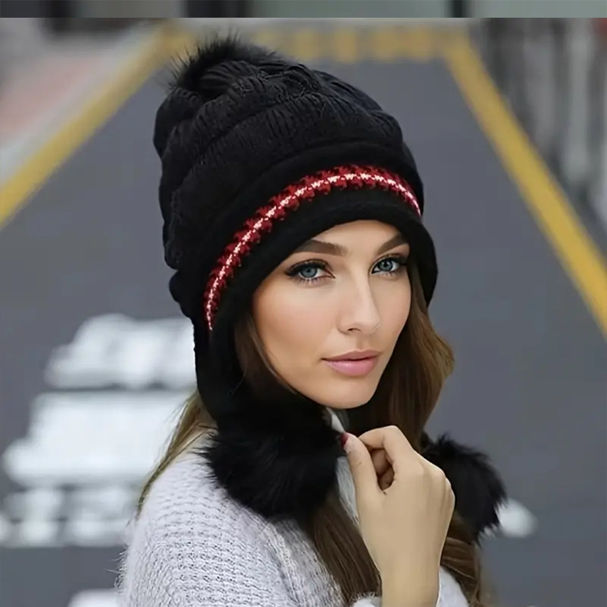 Women's knit beanie with ear flaps and pompom