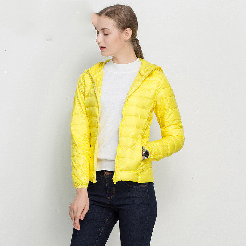 Woman wearing short hooded down jacket with zip front