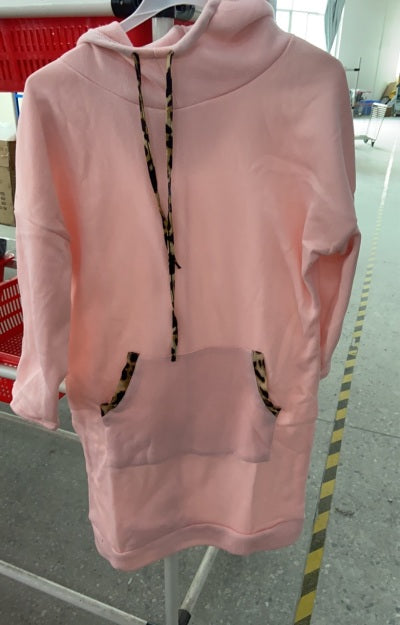 Woman wearing solid color cotton hooded sweatshirt with full hood
