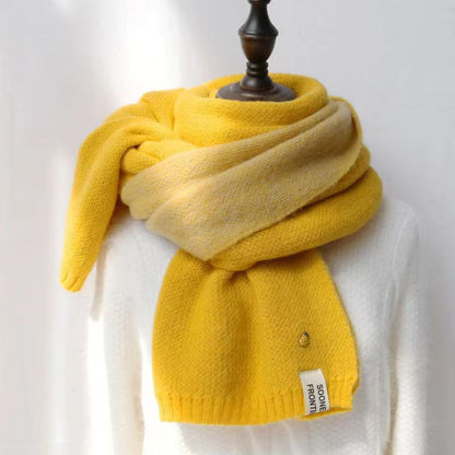 Woman wearing long winter scarf in imitation cashmere fabric