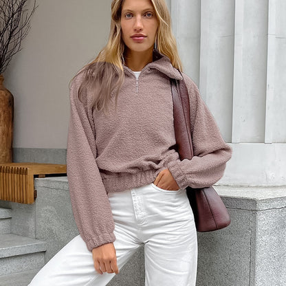 Woman wearing gray lamb fleece jacket with jeans