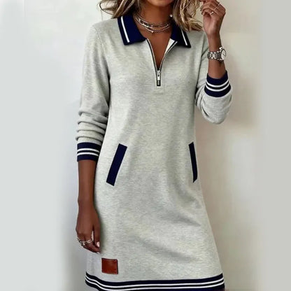 Woman wearing quarter zip polo mini dress with front pockets