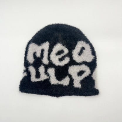 Woman wearing knit beanie hat in winter outfit