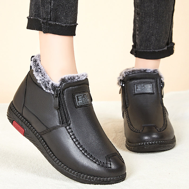 Women's black plush lined winter ankle boots with flat heel