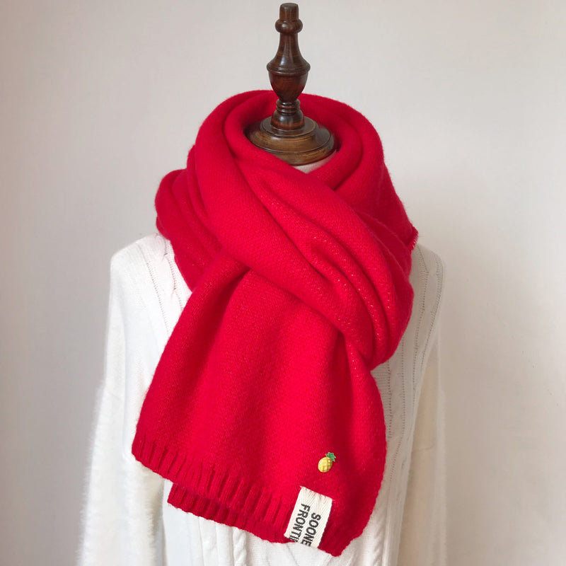Woman wearing long winter scarf in imitation cashmere fabric