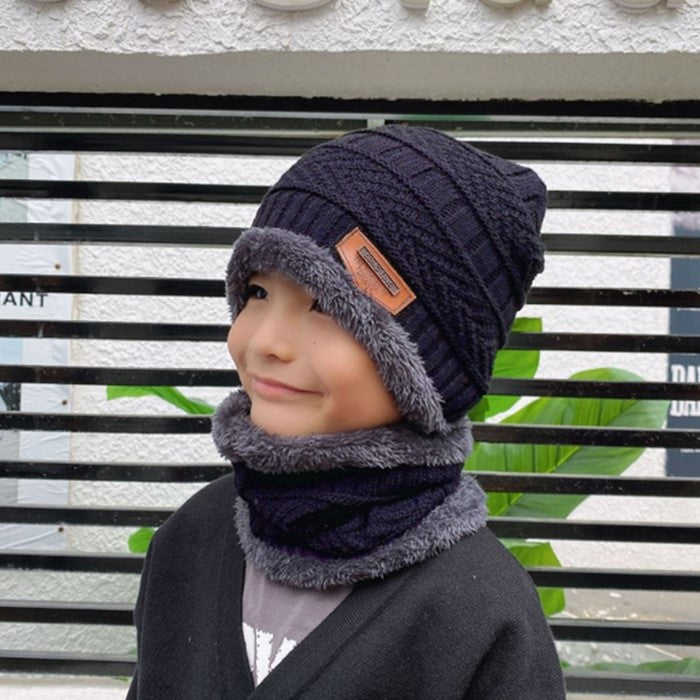 Women's knit beanie and scarf set in winter colors