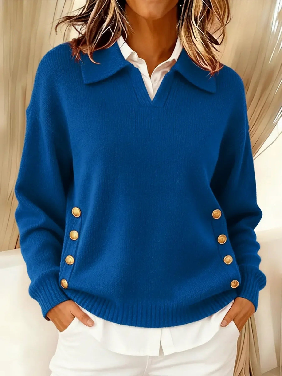 Woman wearing V-neck sweater with fold-over collar