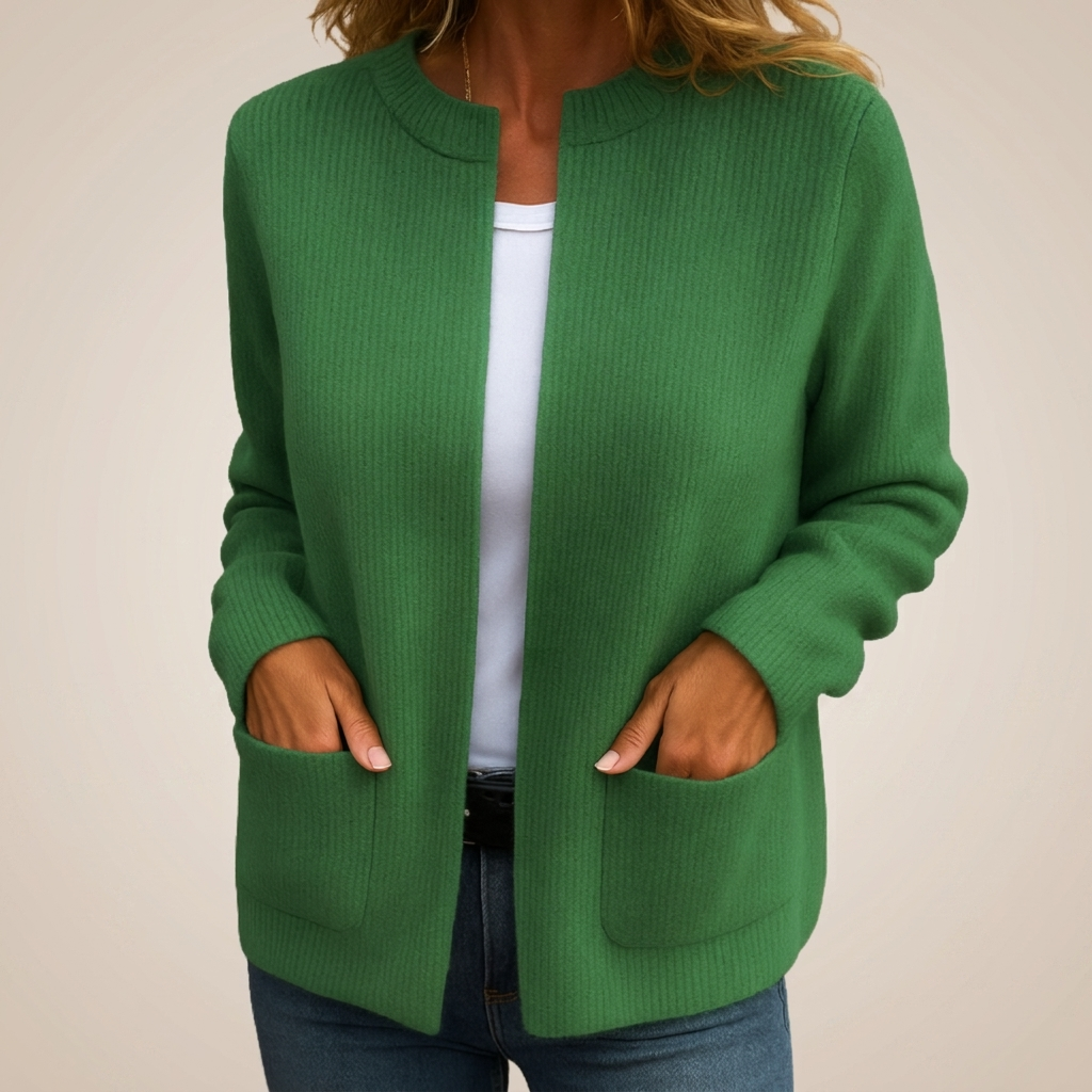 Woman wearing ribbed open front cardigan with front pockets
