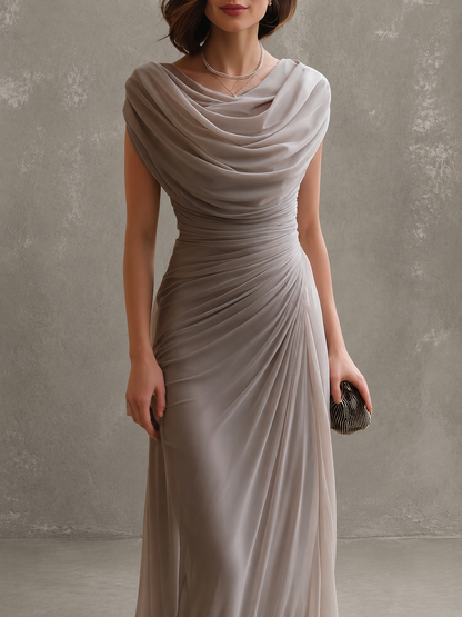 Woman wearing sleeveless draped maxi dress outdoors