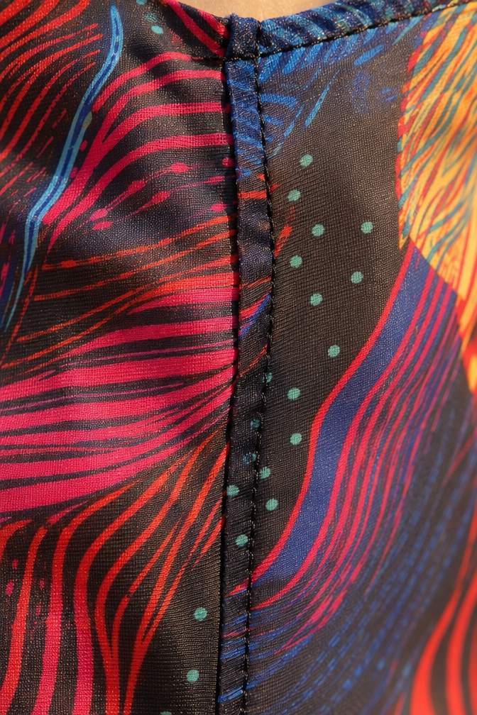 Woman wearing multicolor sheer mesh floor-length maxi dress